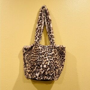 Super soft fuzzy animal print purse.